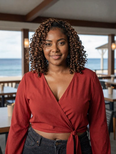 Anaise, 29, a confident Saint Lucian woman at a waterfront restaurant in Gros Islet