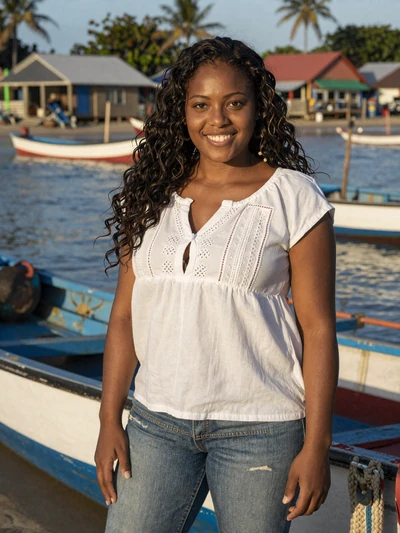Monique, 28, a confident Grenadian woman from the fishing village of Gouyave