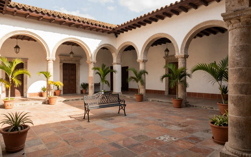 Beautiful colonial courtyard in León Nicaragua with lush tropical plants and warm sunlight