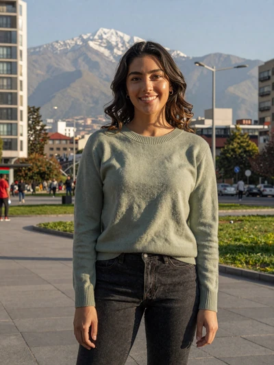 Javiera, 24, a cheerful Chilean woman from Santiago with the Andes in the background