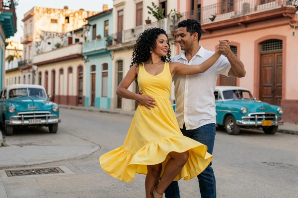 Cuban couple dancing salsa on a vibrant Havana street with vintage cars in the background