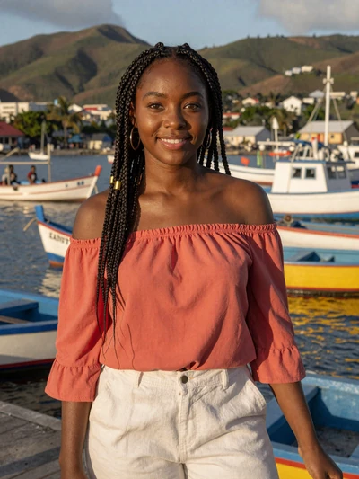 Shanice, 25, a beautiful Vincentian woman from Kingstown with a radiant smile near the harbor