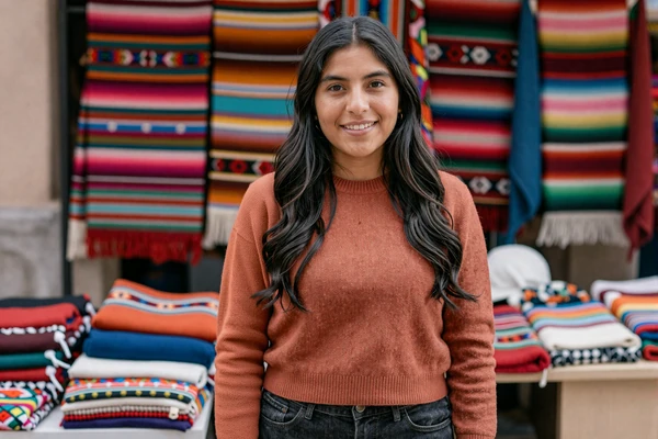 Beautiful Bolivian woman at a colorful traditional market in La Paz, Bolivia