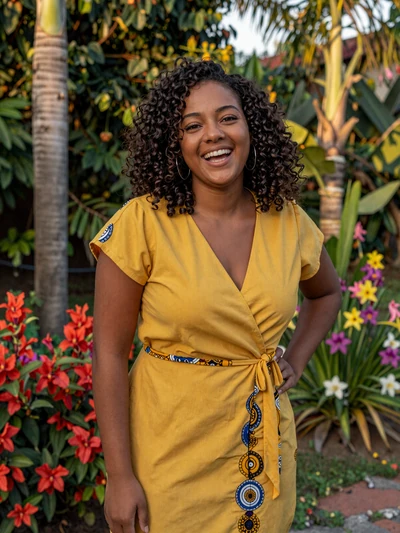 Shanaya, 28, a vibrant Creole-Surinamese woman from Lelydorp with a confident smile
