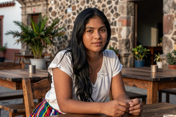 Guatemalan woman enjoying an afternoon at an outdoor café in colonial Antigua Guatemala